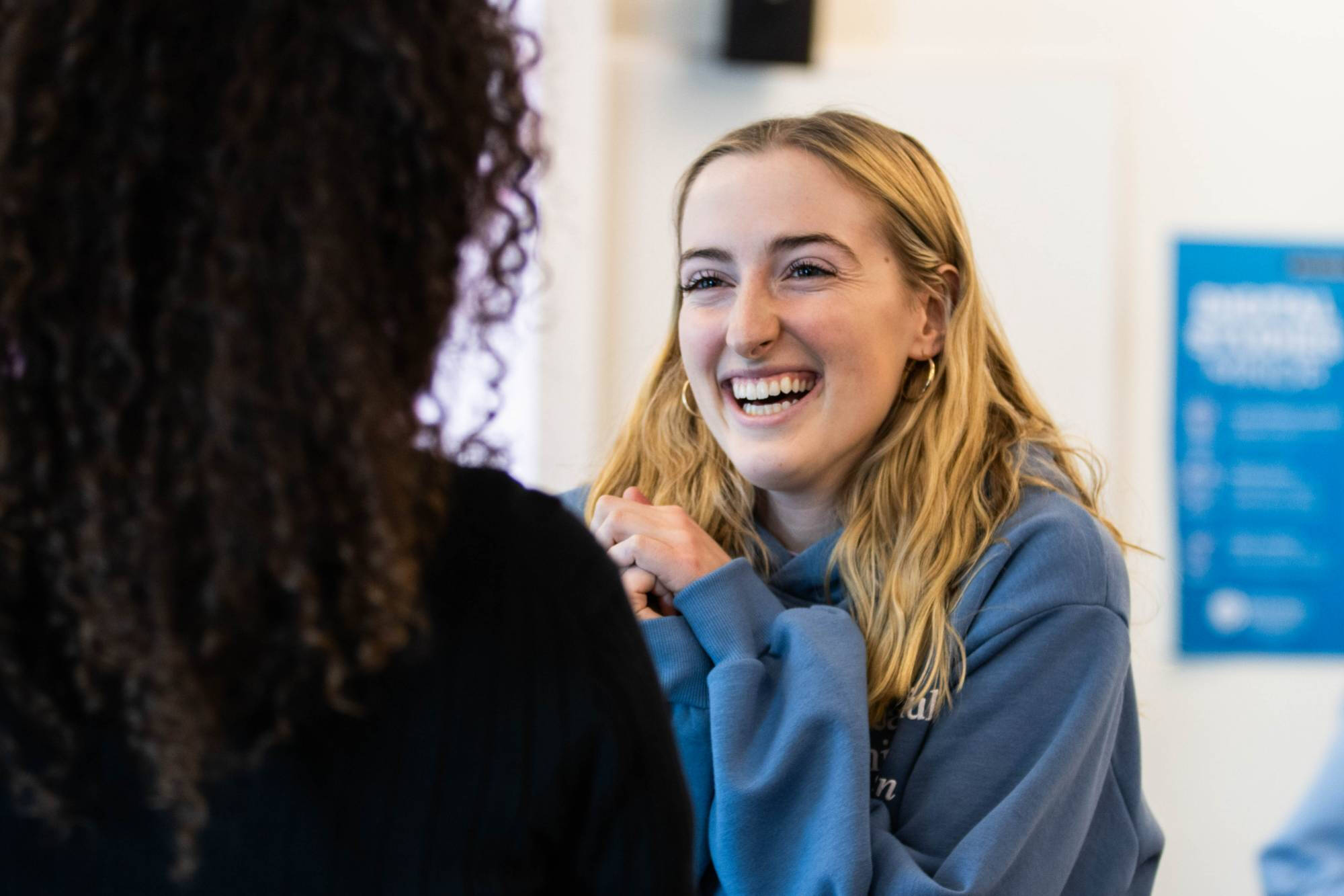 student laughing at something another student said